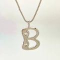 Minimalist silver letter B pendant necklace featuring two small sparkling zircons - Silver B