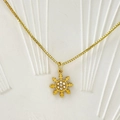 Close-up of golden snowflake pendant with sparkling crystals on a sleek box chain - Snowflake Style (Style B)