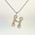 Elegant silver H-letter pendant necklace featuring four sparkling zircon stones - Silver H
