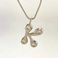 Elegant silver letter K pendant necklace with clear cubic zirconia on a fine box chain - Silver K