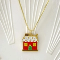 Golden Christmas box chain necklace featuring a colorful gingerbread house pendant - Gingerbread House Style F