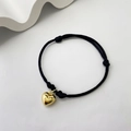 Minimalist black cord braided bracelet featuring a polished gold heart-shaped charm - Gold Heart - Black Rope (1)