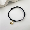 Black woven cord bracelet with gold donut pendant featuring a white sweet cat charm - Sweet Donut Cat - Black Rope (3)