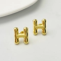 Golden 3D letter H stud earrings with textured wavy finish for women accessories - Gold H