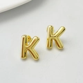 Polished gold 3D initial K stud earrings with minimalist aesthetic and metallic shine - Gold K