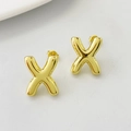 Minimalist gold-plated letter X stud earrings with a polished round surface finish - Gold X