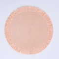 Pink bohemian round woven place mat with decorative tassels and spiral pattern - Pink