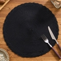Black circular woven placemat with braided border on a wooden table setting - Small / Black