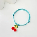 Handmade sky blue woven rope bracelet featuring red cherry charms with golden leaves - Blue Cord Cherry (Style 13 08-0175)