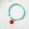 Handmade light blue braided cord bracelet with a glossy red heart pendant and adjustable knots - Polished Heart with Blue Cord