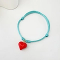 Handmade light blue woven cord bracelet featuring a glossy red heart pendant and adjustable knots - Blue Cord Puffy Heart (Style 21 08-0175)