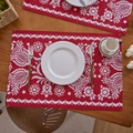 Detailed view of red floral jacquard placemat with white patterns on a wooden dining table - Single Piece / European Floral Red