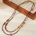 Ethnic style red agate beaded necklace with vintage floral charms and golden metal spacers - Red Agate Sweater Chain (92+5CM)