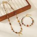 Handgefertigtes Tigerauge Perlenketten-Set mit goldenem Halbmond-Anhänger im Boho-Stil - Sichelmond Schmuck Set