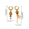 Asymmetric gold earrings with tiger eye beads and golden bird charm on white background - Bohemian Bird Pendant Style (ER-431D01)