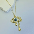 Macro shot of gold-plated evil eye necklace with tear drop pendant on stone background - Blue White Eye (Style A)