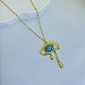 Detailed close-up of gold vintage weeping eye pendant necklace with blue iris detail - Blue Iris with Lashes (Style D)