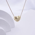 Polished gold heart necklace featuring a sparkling zircon letter M pendant for women - Gold M