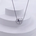 Polished silver heart pendant necklace featuring sparkling zircon letter U on a box chain - Silver U