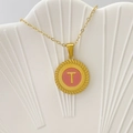 Elegant gold-plated necklace with a pink enamel round letter T pendant on a shell tray - Letter T / Pink
