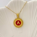 Golden necklace featuring a red enamel round pendant with a textured edge and letter A - Letter A / Red