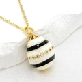Gold 14K plated Easter egg pendant necklace with white enamel and black striped zircon - Black and White