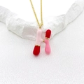 Pink and red enamel letter H bubble pendant on a gold tone stainless steel chain - Letter H Style