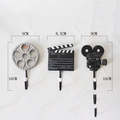Juego de 3 ganchos de pared con temática de cine incluyendo bobina, claqueta y proyector - Juego de 3 Ganchos Tema Cine (E19-16111)