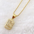 Detailed close-up of golden letter B pendant with micro-paved sparkling cubic zirconia - Gold B