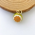 Detailed view of orange slice pendant with vibrant enamel finish and gold jump rings - Green Skin Orange Segment (Model #7)