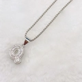 Silver letter Q pendant necklace with clear zircon stones on soft white fur - Silver Q