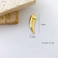 Detail view of gold-plated Italian horn charm measuring 21mm by 6.5mm with weight 0.3g - Horn Shape