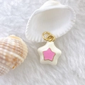 Detail showing enamel star pendant with gold plated edges on soft faux fur background - Star #9