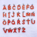 Detail of 26-piece silver metal alphabet charms with bright orange enamel finish for DIY crafts - Letter A / Orange