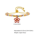 Detail view of adjustable tri-tone beaded bracelet with a red five-petal flower charm - Red Flower Charm Style (PBR-287G02)
