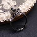 Macro detail of handmade wire wrapped ring featuring a spotted Dalmatian Jasper stone bead - Dalmatian Jasper