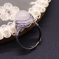 Handmade wire wrapped ring featuring a round light pink quartz stone and silver band - White Crystal