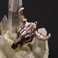 Macro detail of acrylic longhorn skull pendant with gold trim on a white crystal cluster - 46x50mm / Vintage Ivory White (No. 1)