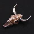 Macro view of vintage longhorn skull charm with silver horns and bone texture detail - Brown Spotted Bull Style (4)