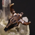 Macro shot of brown acrylic bull skull pendant with rose gold plated edges on crystal - 46x50mm / Vintage Dark Brown (No. 2)