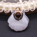 Natural white shell fan-shaped pendant with gold plating and dark gemstone inlay - Tiger's Eye