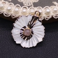 Elegant peach flower shell pendant with gold plating and pink gemstone inlay - Rose Quartz