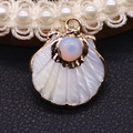 Golden scallop shell pendant with white mother of pearl and turquoise center inlay - Opal