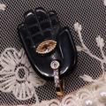 Vintage gold ring with marquise champagne stone and small zircons on black hand display - 17x32mm / Black Agate