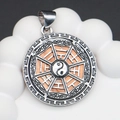 Macro detail of silver Tai Chi Bagua pendant with peach wood inlay and cloud patterns - 34x39mm / No.8 (Light Orange Shell)