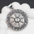 Silver-plated Tai Chi Bagua pendant with white shell inlay on a white wave stand - 34x39mm / No.1 (White Shell)