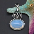 Detailed view of an oval blue opal pendant displayed on a starfish decoration - 28x44mm, 10g / Opal