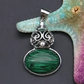 Macro shot of malachite stone pendant with hollow silver filigree and small diamond - 28x44mm, 10g / Malachite