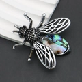 Fliegen-Brosche aus Silberlegierung mit hohlen Flügeln und buntem Abalone-Muschel-Inlay - Abalone-Muschel