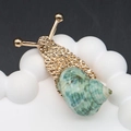 Artistic gold snail brooch with a blue-green spiral seashell shell on a ceramic stand - 20-60mm, 15g / Gold Natural Green Shell